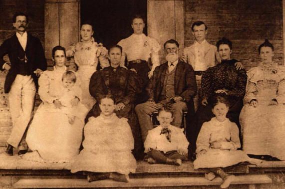 Standing (L to R): Abel Soulé Donnaud, Cecile Ernestine Guedry (Mrs. George Cousins, Aunt Sis), Marie Celeste Guedry (Mrs.
          Wendeline Weimer), Louis Alphonse Scotto; Seated (L to R): Celeste Emilie Guedry (Mrs. Abel Soulé Donnaud, holding baby
          Charles Donnaud), Marie Leontine Gaudet (Mrs. Charles Joseph Guedry), Charles Joseph Guedry, Josephine Marie Guedry (Mrs.
          Louis Alphonse Scotto), Aimie Eugenie Guedry; Children in front (L to R): Marie Lucie Guedry, Joseph Leon Guedry, Leontine
          Amelie Guedry. [Taken ca. 1899 at home of Charles Guedry near Thibodaux, Lafourche Parish, Louisiana.]