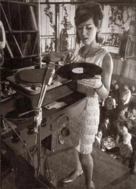 Joanie Labine spinning records in her cage