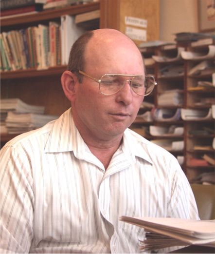 Marty Guidry arranged for the Jan. 26, 2002 meeting and is seen here reading for a list of "Must Do" items