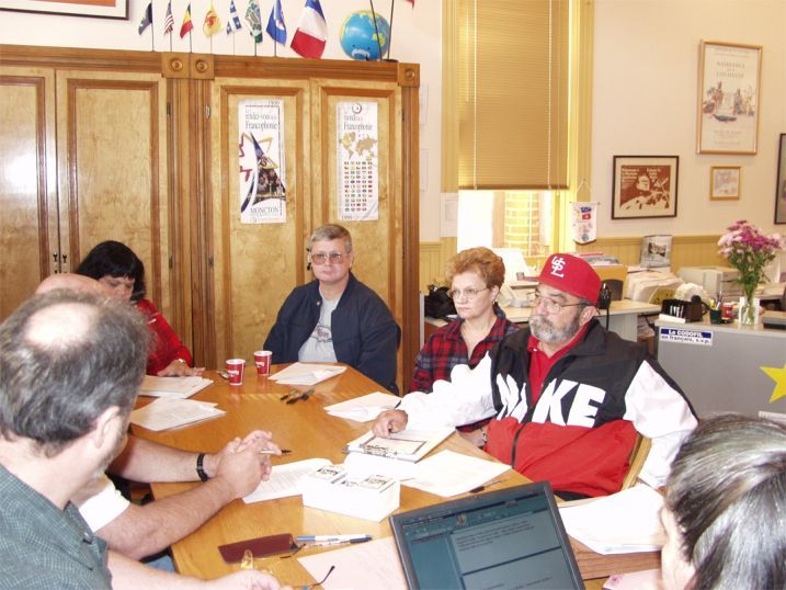 Guidrys in deep thought and discussion in the CODOFIL office