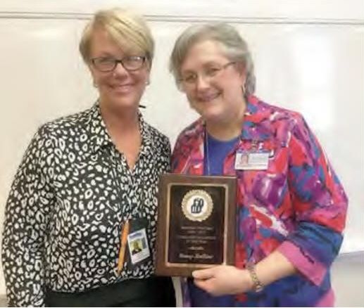 Laura Boyd, Family Resource Agency special projects specialist, presents Nancy LaBine, CSCC director of nursing with the Tennessee Head Start 2015-2016 Community Volunteer of the Year